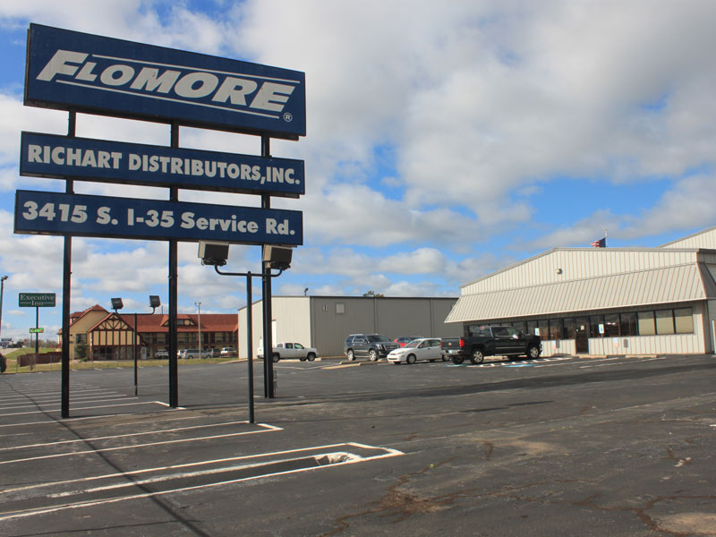 Flomore richart distributors, inc. 3415 s i-35 service rd sign in front of building